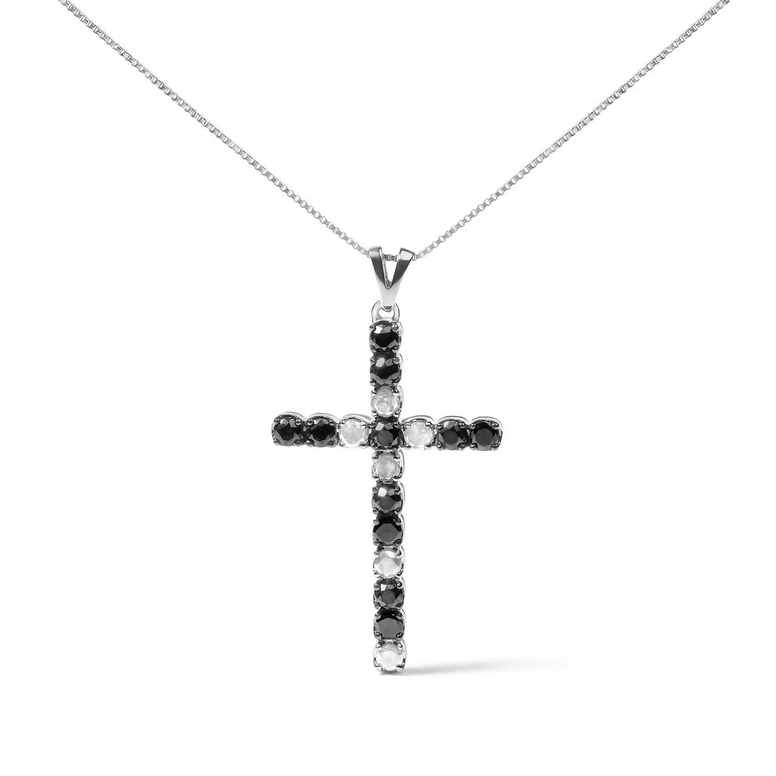 .925 Sterling Silver 1.0 Cttw Black and White Diamond Alternating Classic Cross 18" Pendant Necklace: Imbued with a serene elegance, this cross pendant necklace marries the timeless allure of sterling silver with the enigmatic contrast of black and white diamonds. With a total weight of 1.0 carat,