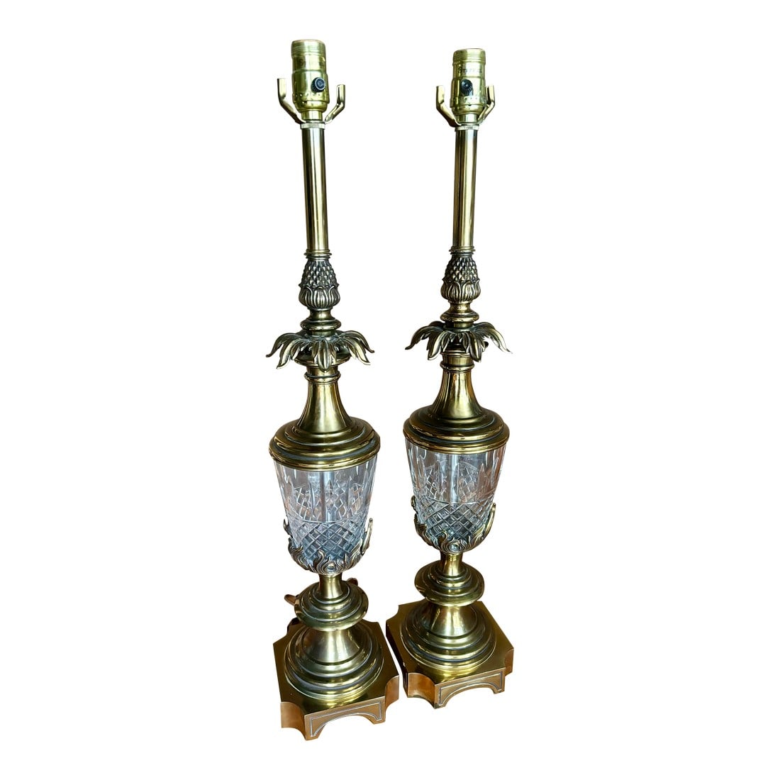 Vintage Mid-Century Stiffel Hollywood Regency Brass & Crystal Pineapple Table Lamps, a Pair: Vintage Stiffel brass and cut glass pineapple, Hollywood Regency style set of table lamps. It looks as though the brass is in "flames" around the cut glass pineapple shape. These are tall and heavy an