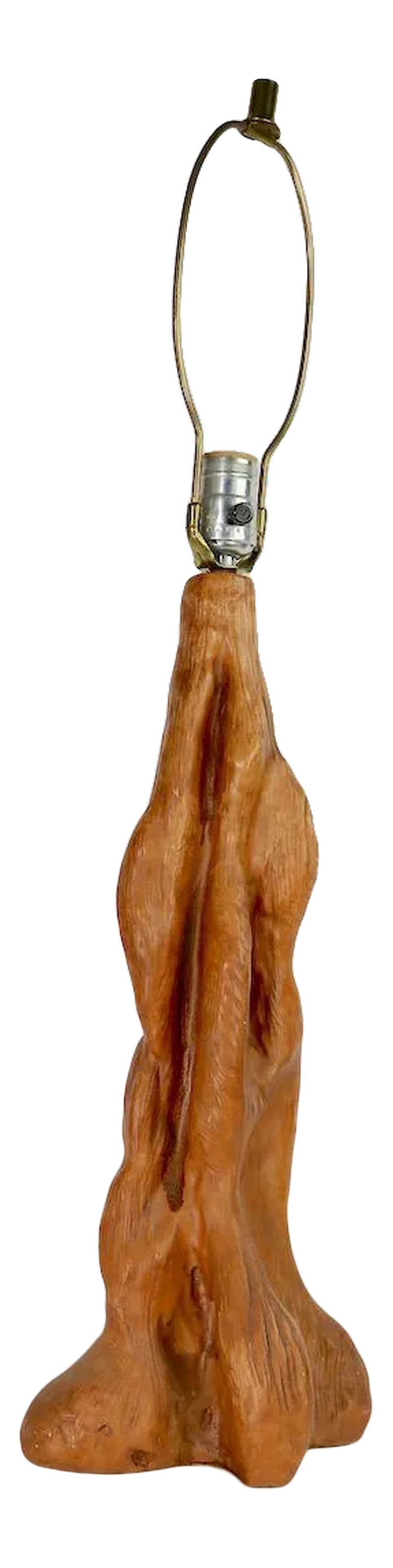 1950s Organic Modern Faux Wood Ceramic Table Lamp: Chic Organic Modern table lamp of cast plaster, to simulate free form wood. Clean and working condition, shade not included.Total H 29.5 x H to top of socket 21.5. Condition: Alterations: Original Con