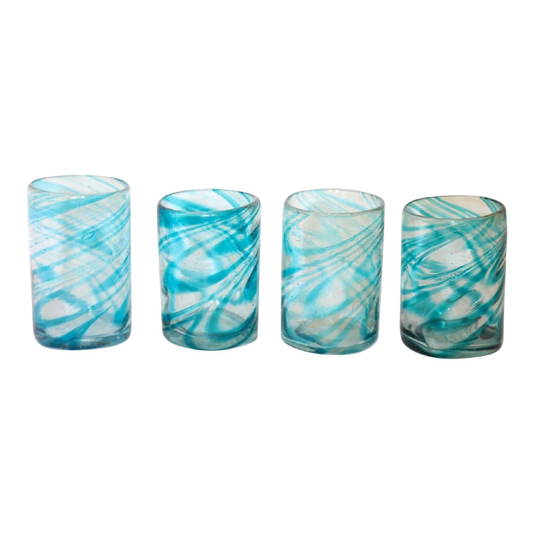 Hand Blown Drinking Glasses Handcrafted Blue Swirl Set of 4: Hand Blown Drinking Glasses Handcrafted Blue Swirl set of 4. Each of these glasses are handcrafted by Mexican Artisans. As these are individually made none of them are exactly the same, they may show