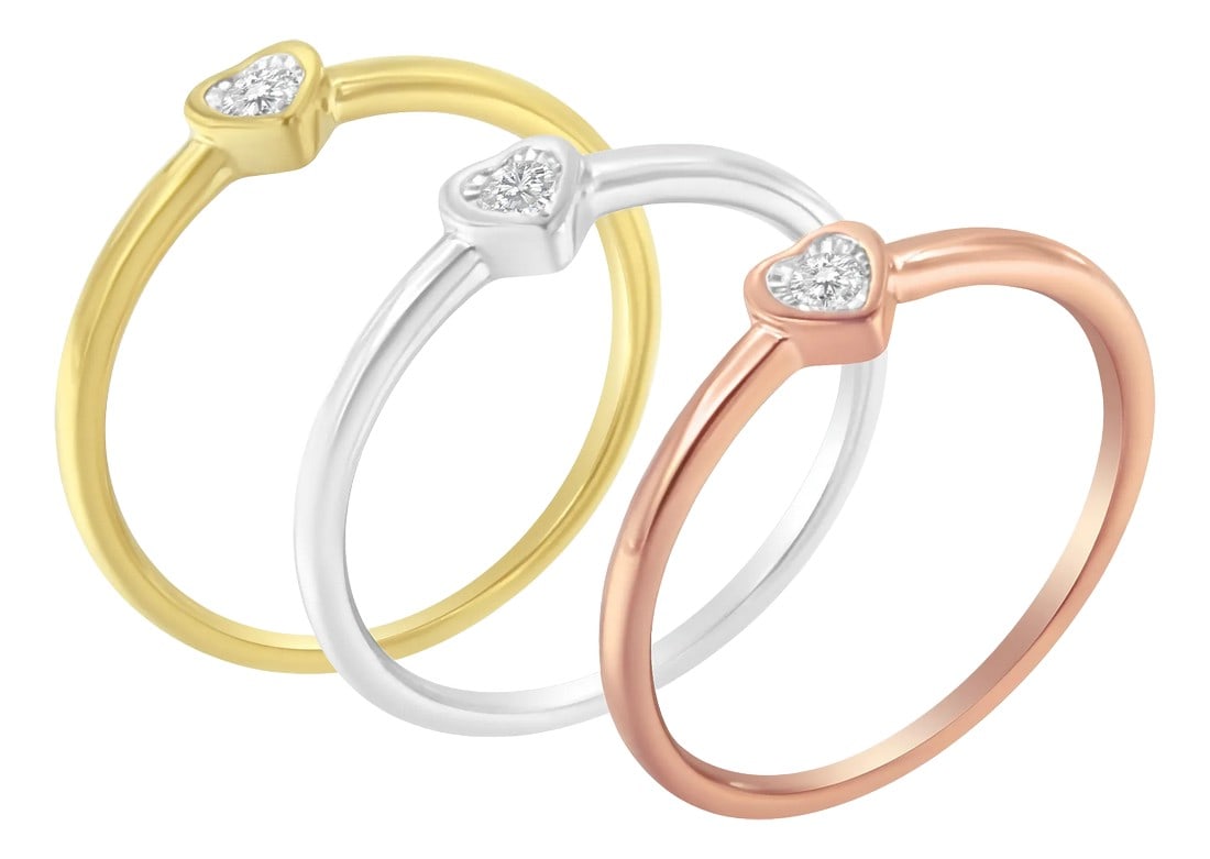 .925 Sterling Silver Diamond Heart Shaped Stackable Promise Ring Set (1/6 Cttw, J-K Color, I1-I2 Cla: Diamond heart shaped stackable ring set. Each ring features a central round diamond miracle set in a yellow, white, or rose sterling silver setting. The diamonds weigh 1/6 carats tdw. Metal: .925