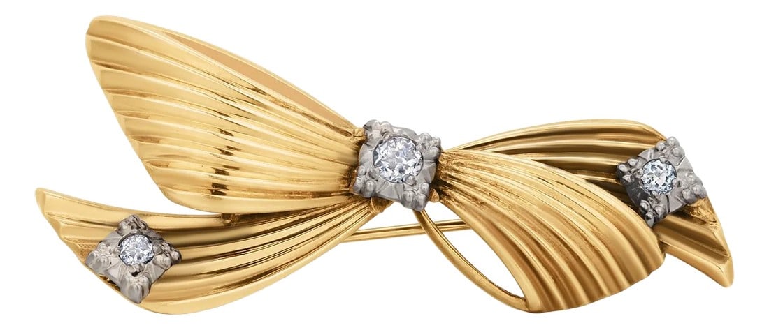 Vintage Tiffany and Co. 14k Yellow Gold Diamond Bow Love Knot Brooch: A Timeless Emblem of Elegance and Grace Indulge in the enduring beauty of this Tiffany & Co. Vintage Diamond Bow Love Knot Brooch, crafted in 14K yellow gold and set with three sparkling diamonds. A