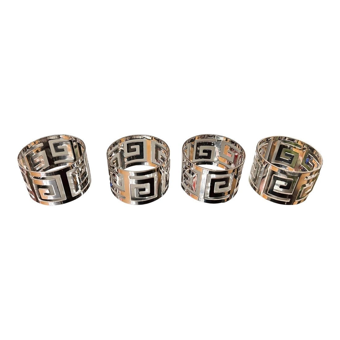 1970s Collection of Silver Greek Key Napkin Rings- Set of 4: Up for consideration is a beautiful collection of silver Greek key napkin rings. These would look lovely in your home and they are a great find for the interior design enthusiast. Please check out my