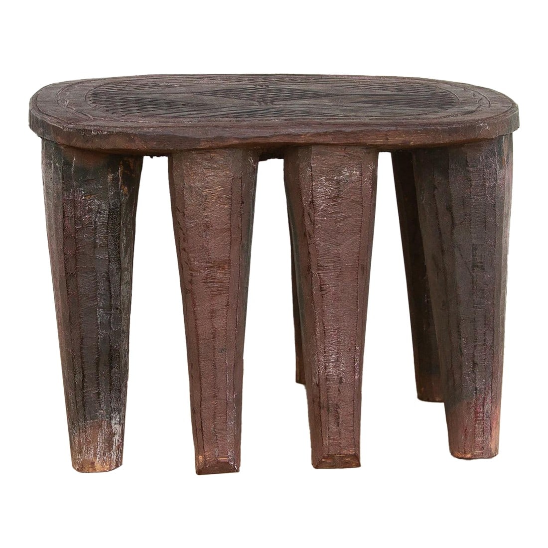 Small 8-Legged African Carved Stool: A unique piece of African art, this vintage Nupe table from Nigeria is a must-have for collectors and enthusiasts of Nupe culture. Carved from a single log of wood and standing on 8 chunky tapered leg