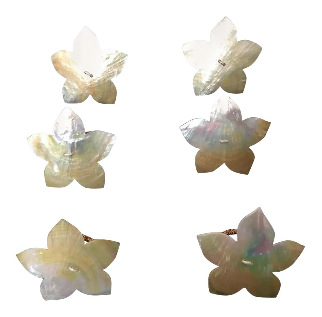Handcrafted Napkin Rings in Natural Capiz Pearl Shell Flower Star Shape - Set of 6: Set of six napkin rings in natural capiz pearl in flower star shape. Luminous, beautiful pearl shell color. vintage set of 6 flower shaped made of natural semi iridescent capiz shell. Due to the