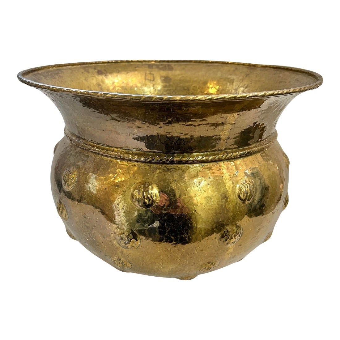 Mid 20th Century Large Chased or Hammered Brass Planter With Tope Trim and Repousse Button Accents: This large brass planter was made in Italy in the mid 20th century. The round base is decorated with a hammered finish and repousse buttons. The top is cinched with rope trim and the flared rim has