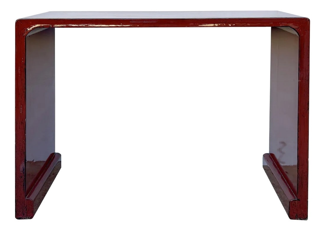 Gloss Brick Blood Red Lacquer Rectangular Console Foyer Side Table: This table boasts a sleek, minimalist design with a smooth, rectangular tabletop finished in a weathered brick blood red, lending it an industrial yet refined appeal. The table is supported by two