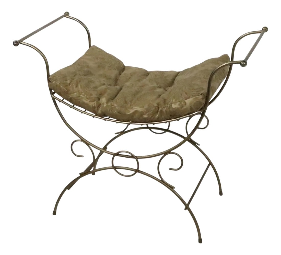 Mid 20th Century Hollywood Regency Vanity Bench: Chic Hollywood Regency, Mid Century, Art Deco style wrought iron vanity bench, with upholstered cushion. The bench features a decorative wrought iron frame with an opposing U shaped top and bottom