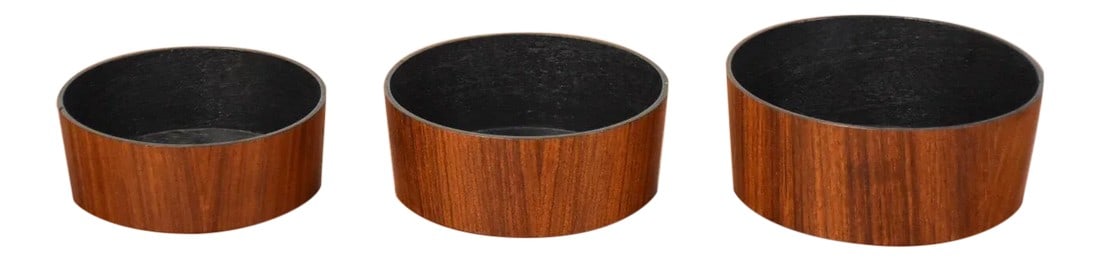 1960s Teak Danish Nesting Bowls - Set of 3: A set of three Danish style teak nesting bowls with black interiors. Smallest bowl is 5" in diameter and 2" tall. 6" wide. 6" deep 2.5" tall. Condition: Alterations: Restored Imperfections: Some