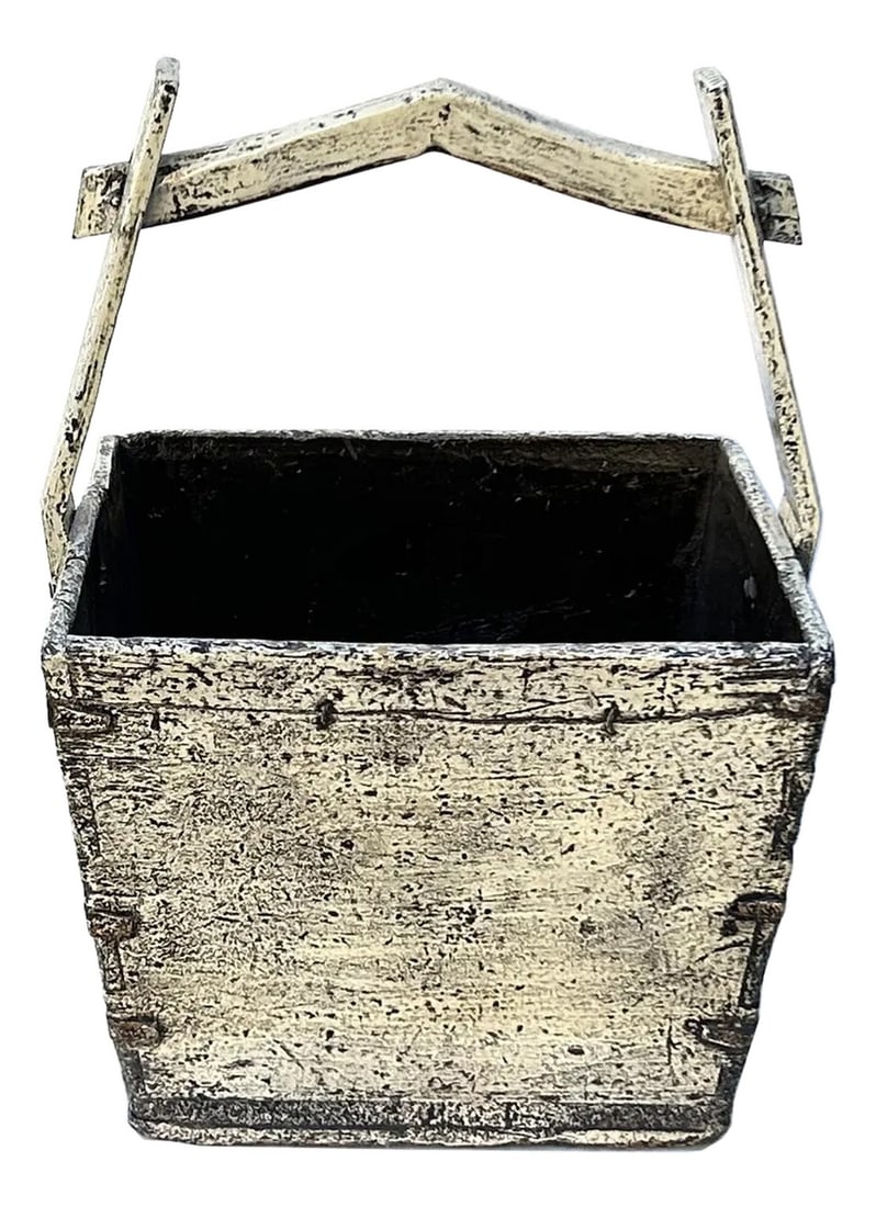 Vintage Rustic Off White Square With Handle Wood Bucket: This rustic wooden bucket exudes a timeless, weathered charm, showcasing the beauty of aged craftsmanship. Constructed from sturdy planks of wood, the bucket features a distressed gray marks off