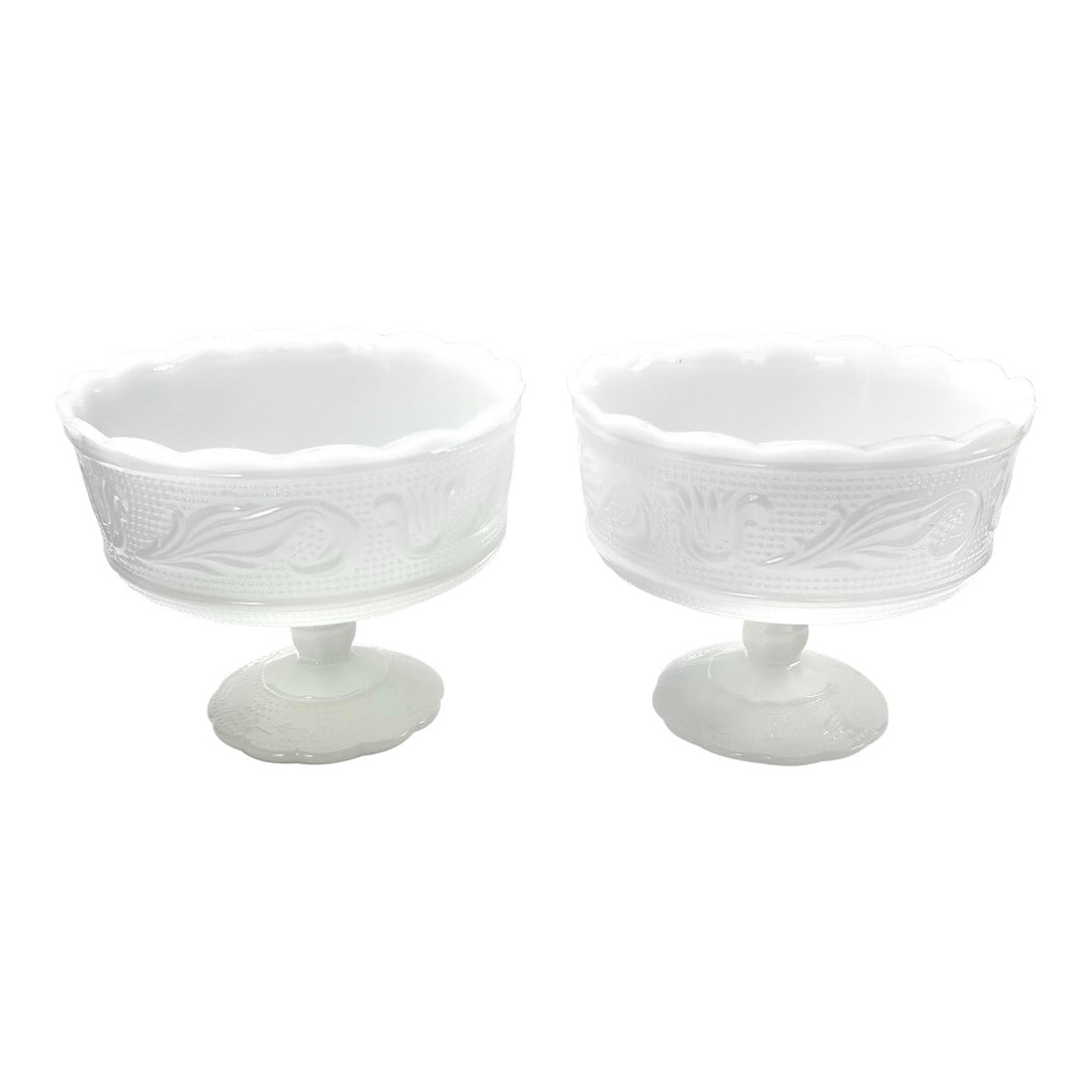 1940s Matching Milk Glass Compotes Fruit Bowls - A Pair: These beautiful milk glass compotes were made by the E.O. Brody company, most likely in the 1940s. They feature scalloped edges with a raised pattern of swooshes and dots. They're stamped "E.O Brody