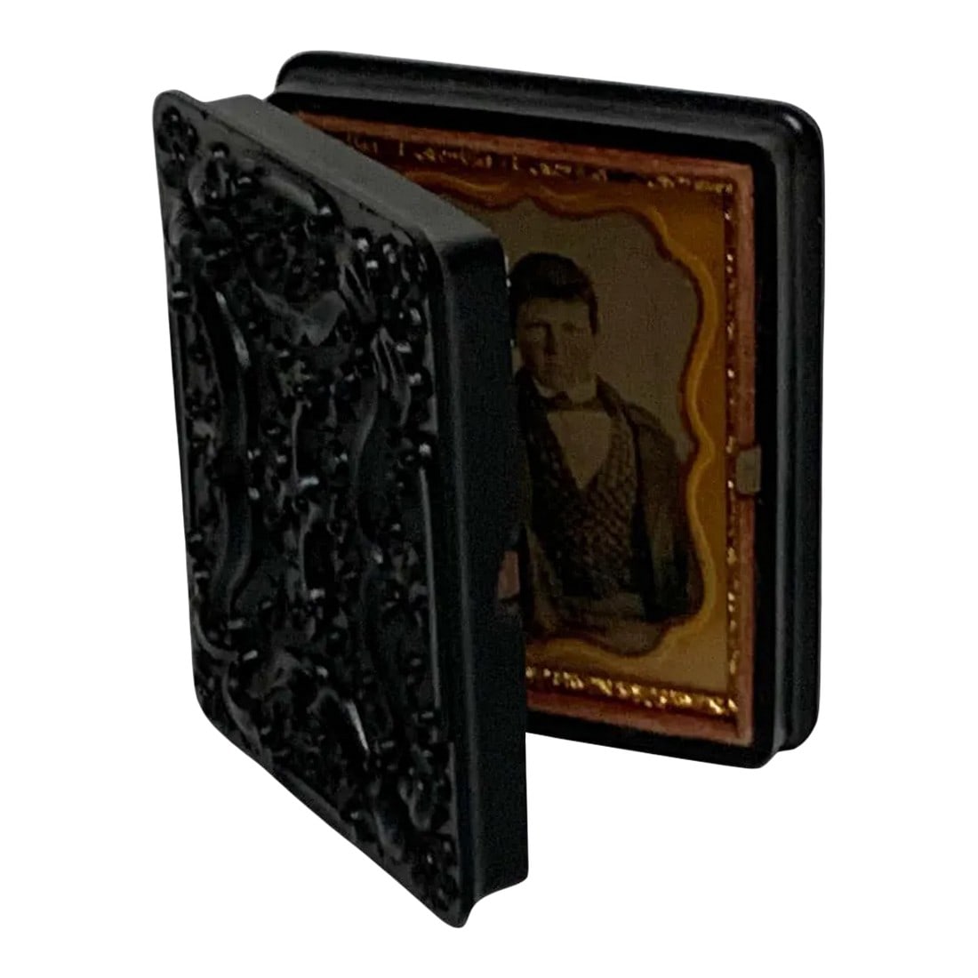 19th Century Ambrotype of a Young Male Student/ Writer, Gutta Percha Case: 19th century ambrotype of a young male student/ writer, gutta percha case An unidentified well dressed standing young man, with pen in hand, in beautiful gutta percha Measures: Case 2.5" x 3" H Image