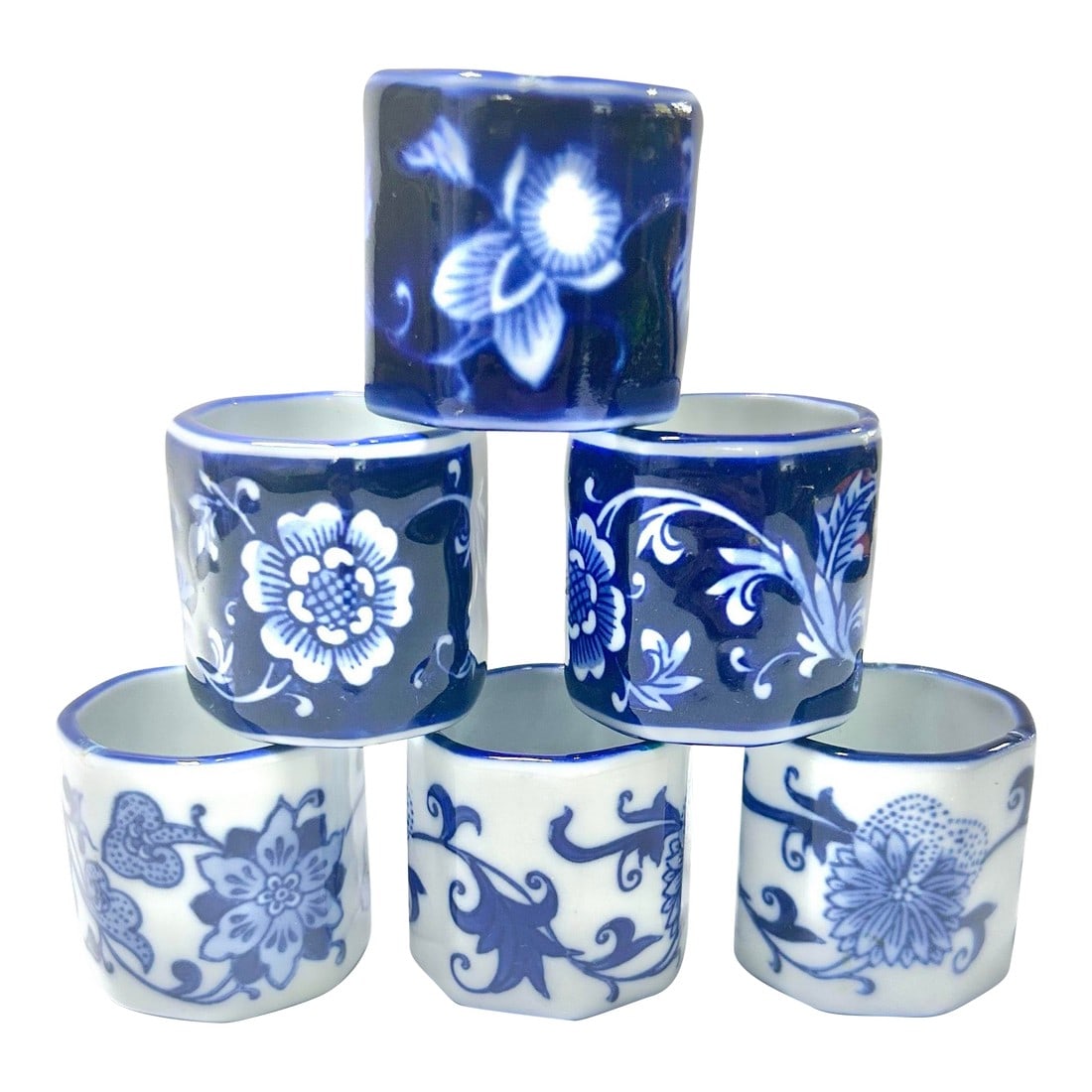 Vintage Chinoiserie Blue & White Porcelain Napkin Rings With Floral Pattern- Set of 4: A beautiful set of porcelain napkin rings. They are well-crafted and the pattern is very detailed. The shades of blue are stunning! Dimensions 1.5" tall 1.5" wide/deep Condition: Alterations: