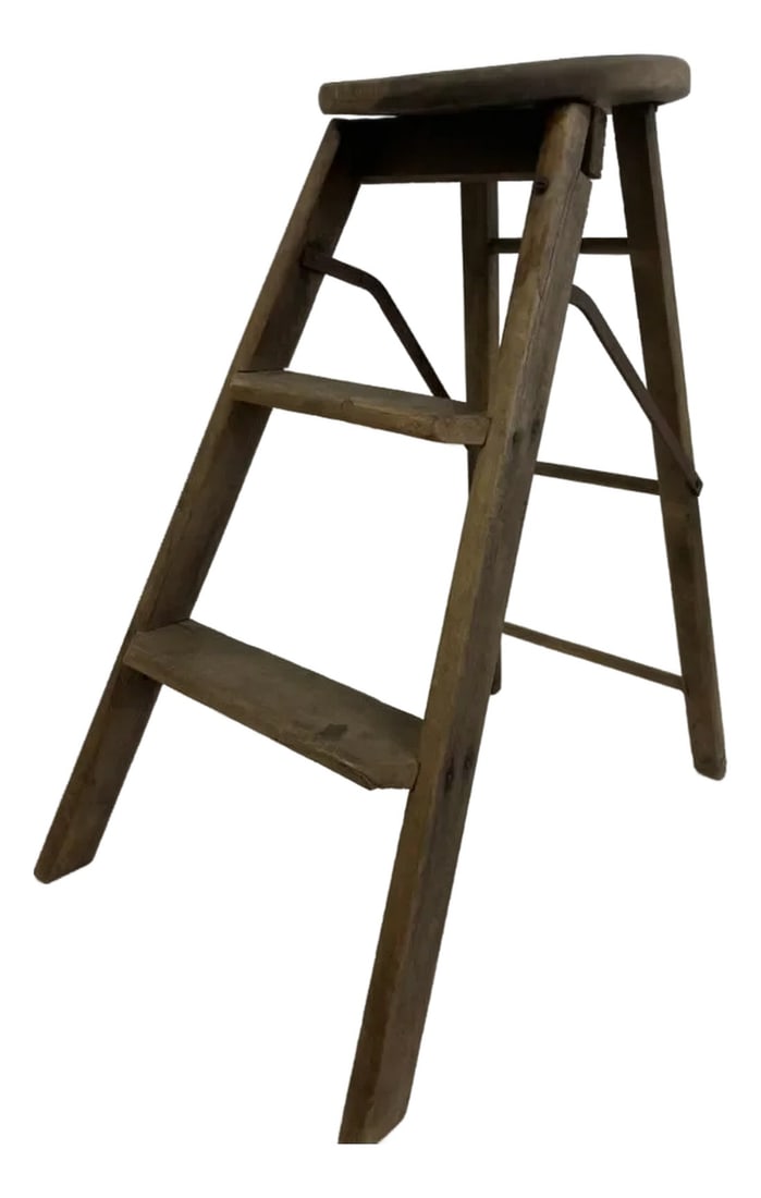 1950s Vintage Wooden Step Stool Chair – Folding Utility Stool With Round Seat: This vintage wooden step stool chair, dating from the mid-20th century (circa 1940s–1950s), features a clever folding design with a round seat, built-in steps, and original metal support braces.