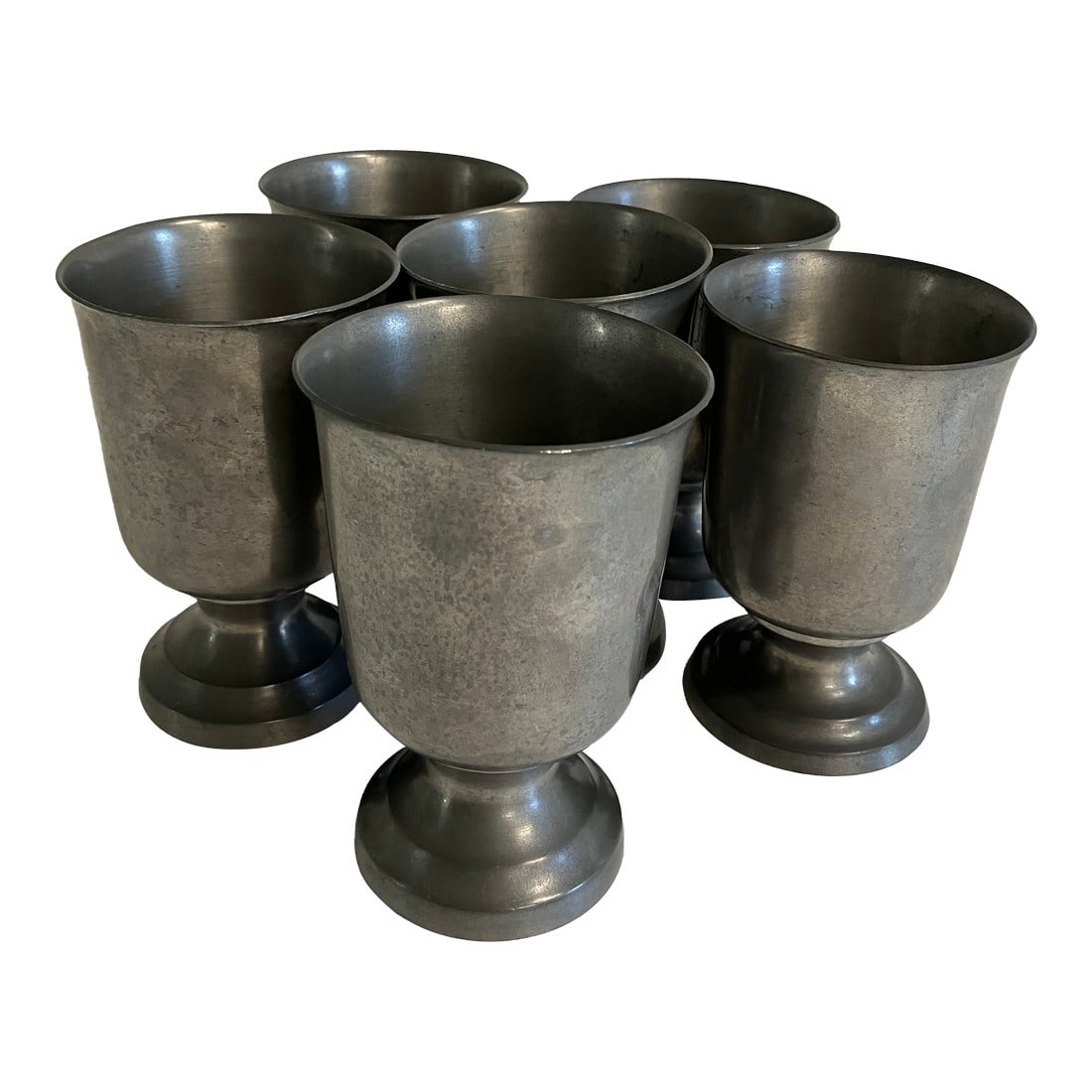 Set of 6 Vintage Pewter Goblets – Woodbury Pewter, Mid-20th Century: A set of six vintage pewter goblets crafted by Woodbury Pewterers of Connecticut, a company established in 1952 and known for their fine handcrafted pewter. These goblets feature a classic flared