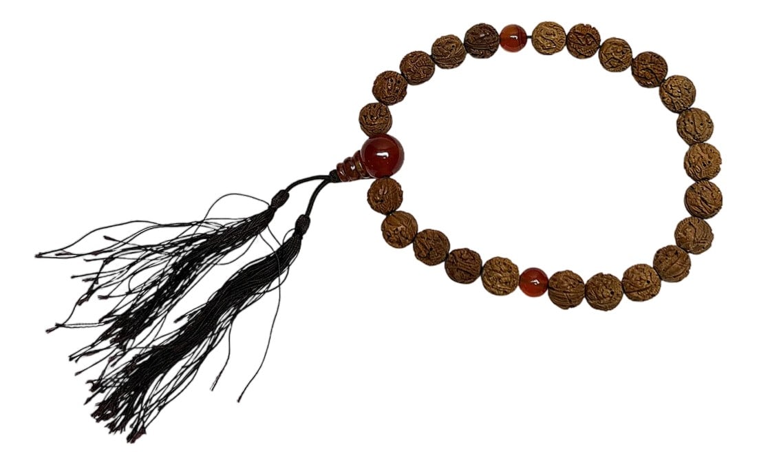 Light Brown Seed Carving 23 Beads Hand Rosary Praying Chain: Handcrafted with intention, this mala bracelet is a beautiful and meaningful accessory. Each bead is a carved rudraksha, a seed revered for its spiritual significance and believed to bring peace and