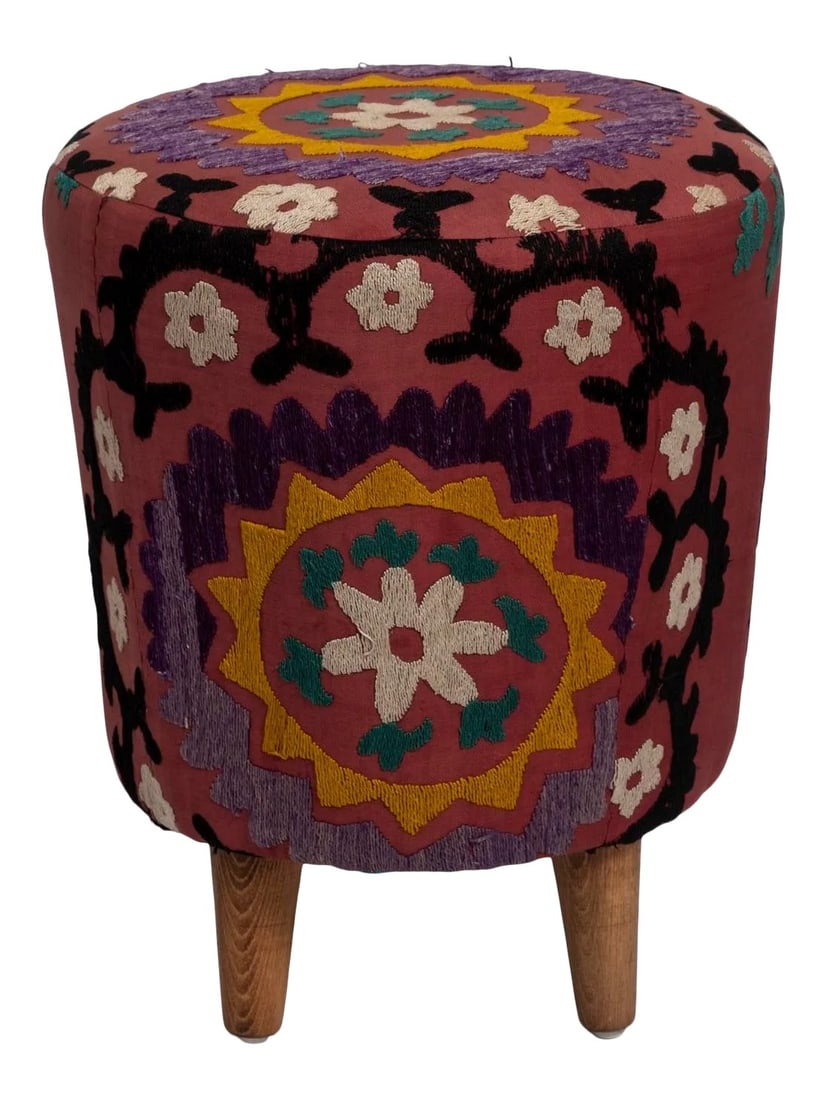 Modern Handwoven Uzbek Suzani Ottoman Footstool: Colorful round ottoman upholstered with vintage Uzbek suzani fabric. This one-off footstool has been lovingly restored with Vintage embroidery from the Middle East Dimensions: Foot Stool 18 "Height