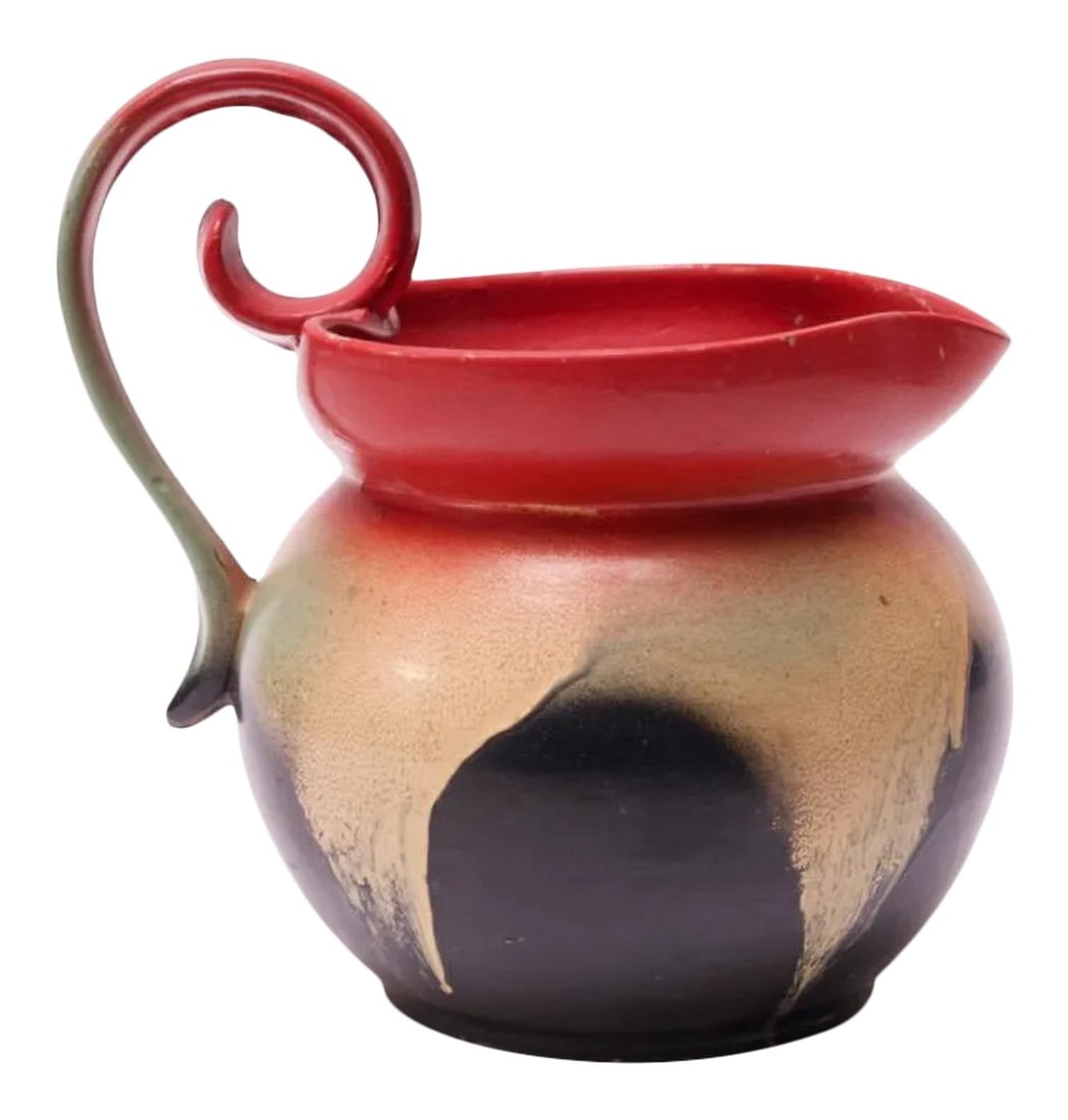 Mid-Century Dutch Hand-Painted Ceramic Decorative Pitcher: Circa 1960s Holland hand-painted ceramic pitcher with decorative handle. Intriguing piece in red with cream / yellow, green and black abstract design. Incised "Made in Holland" signature present to