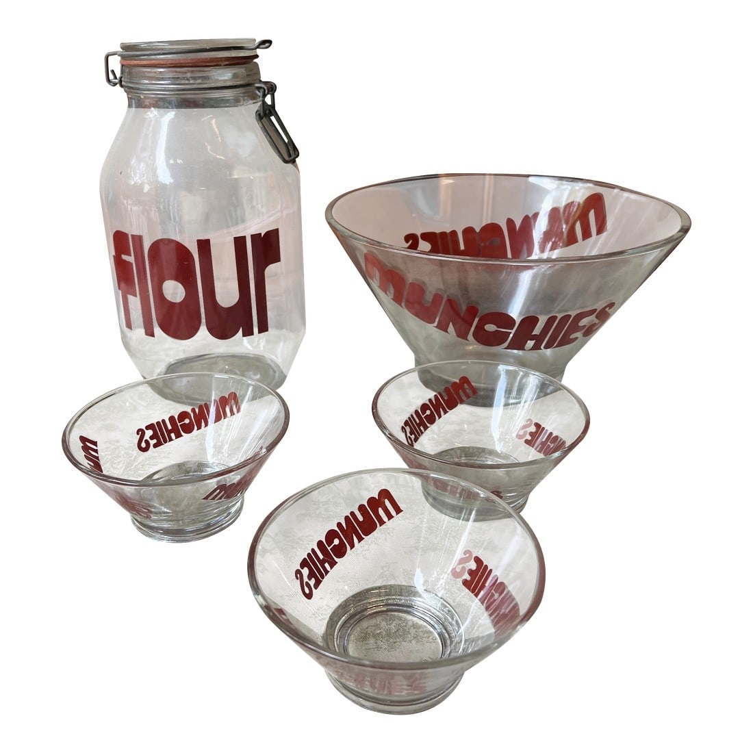 1970s Collection of Red Font Munchies Bowls and Flour Jar- Set of 5: Up for consideration is a beautiful vintage set of red font munchies bowls and flour jar. This set would look lovely in your home on display or in use. This is also a great find for the interior