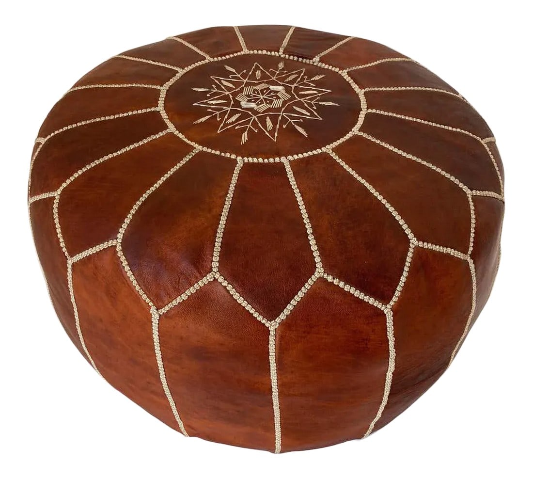 Moroccan Handcrafted Leather Brown Ottoman: Moroccan handcrafted brown camel leather ottoman, with embroideries. Could be used a foot stool, or side table or ottoman. The Moroccan leather poufs are hand-tooled and embroidered with white tread.
