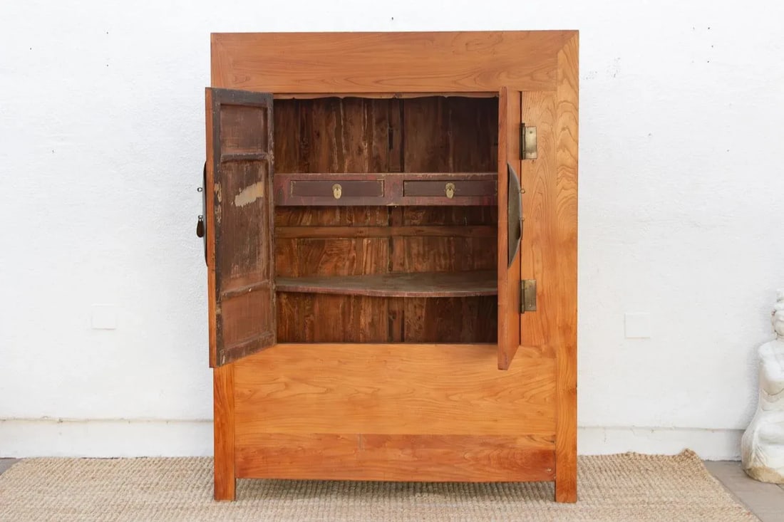 19th Century Chinese Elm & Brass Armoire: This impressive tall antique Chinese cabinet is a powerful testament to the elegant minimalism of traditional craftsmanship. Likely dating to the late 19th or early 20th century (Late Qing or