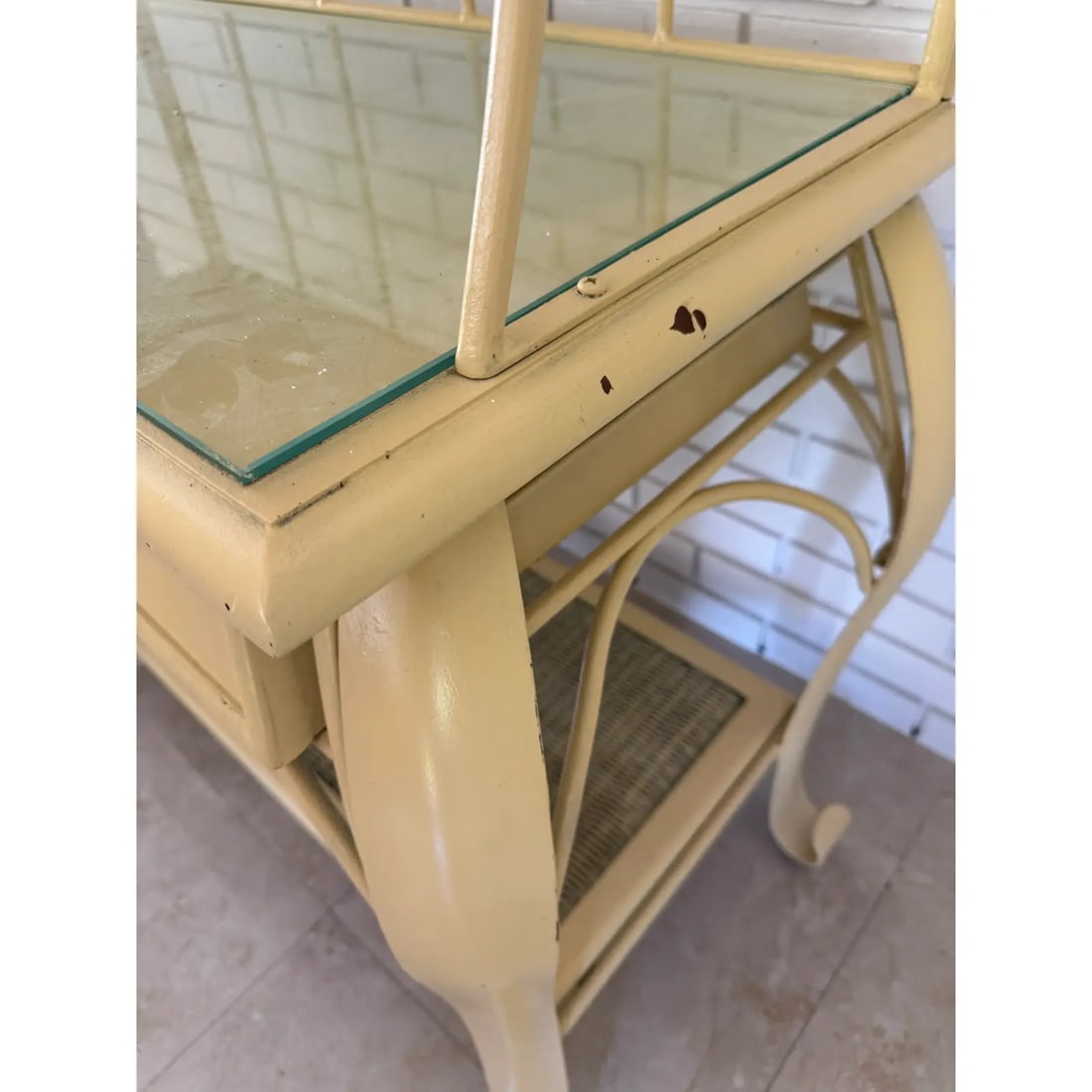 Vintage 1970s Wrought Iron Bakers Rack With Woven Rattan Shelves: This timeless and charming 1970s baker's rack features a sturdy wrought iron frame and beautifully woven rattan shelves and four-tier open shelving with elegant scrollwork and arched top detail.