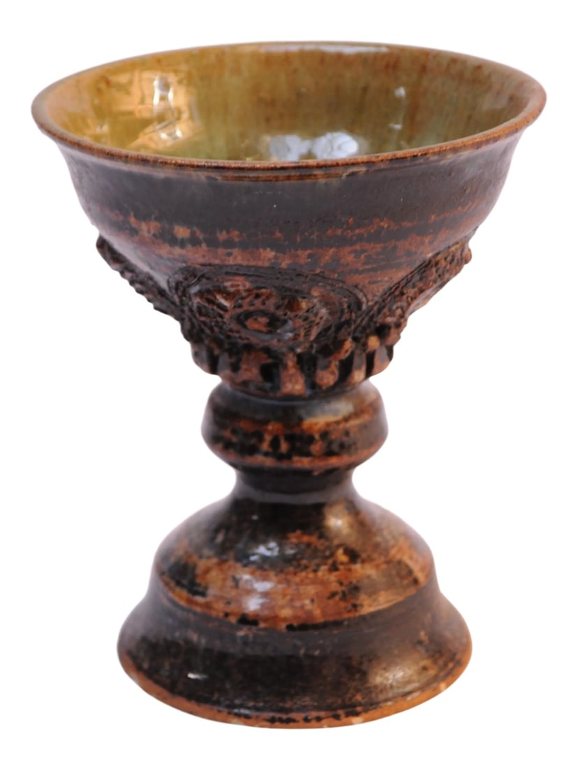 Studio Pottery Goblet / Chalic: Circa 1970s studio pottery chalice with a heavily textured geometric decoration. Attractive color combinations and patterns. Very good, vintage condition free of chips, cracks, and losses. Internal