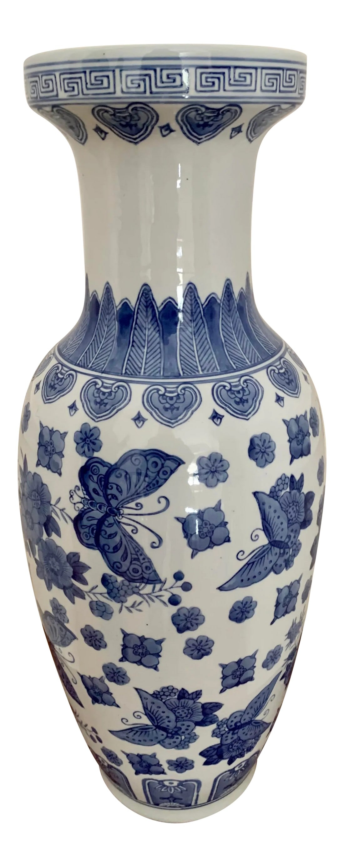 Chinoiserie Tall Blue and White Porcelain Urn: Hand painted tall blue and white vase with a floral and butterfly motif. Great addition to your blue and white collection. Condition: Alterations: Original Condition Unaltered Imperfections: Some