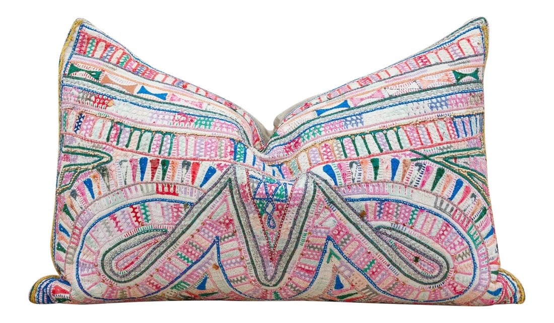 Paann Antique Tribal Grain Sack Pillow: These colorful throw pillows are made from Rabari tribal dowry bags. The embroidery is on cotton and has intricate chain stitch of embellished patterns, motifs of flowers, peacocks and other tribal