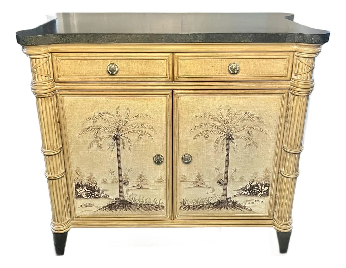 Hollywood Regency Palm-Form Coastal Cabinet With Hand-Painted Finish: A sophisticated Hollywood Regency cabinet featuring a hand-painted tropical finish, carved bamboo-inspired corner pillars, and a polished stone top. The piece balances coastal warmth with Regency