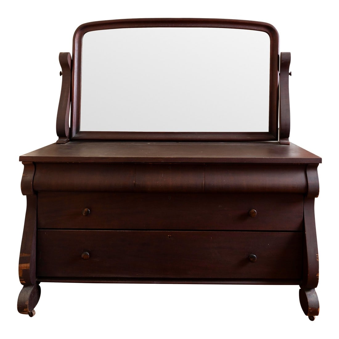 Antique Dresser With Mirror – Solid Mahogany: Stunning antique dresser with an attached swivel mirror. This piece features classic Empire-style lines with gracefully curved sides and bracket feet. The rich, dark finish highlights the natural beau