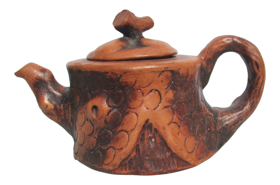 Chinese Folk Art Terra Cotta TeaPot Vintage 50s': Handmade teapot in the style of Yixing with bark and tree-formed handles. Red clay with carved and impressed tree textures. The size is 7" from spout to the handle. The diameter is 4" in diameter