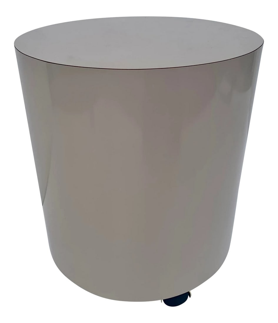 1980s Cylindrical Laminate Stool on Casters: Vintage 1980s laminate vanity stool on brass caster wheels. Beautiful minimalist style, cylindrical stool, wrapped in a taupe colored laminate. Excellent vintage condition. 18.5h 15.5w/d 