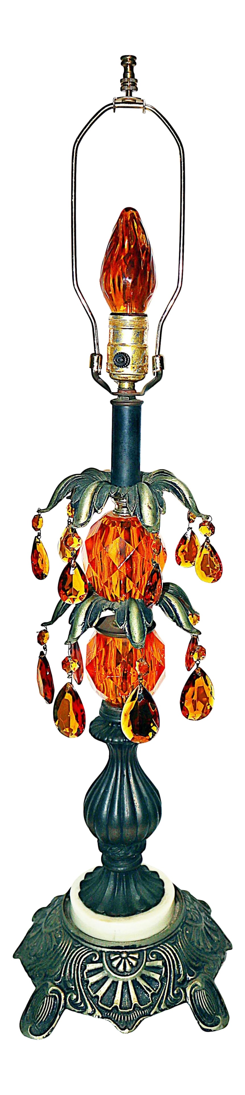 Hollywood Regency Crystal Table Lamp: Sparkle and glam with this Hollywood Regency 1940s crystal table lamp. Deep orange teardop pendules drape from a dark pewter bronze metal leaves stand upon a marble and metal footed base. Wired and