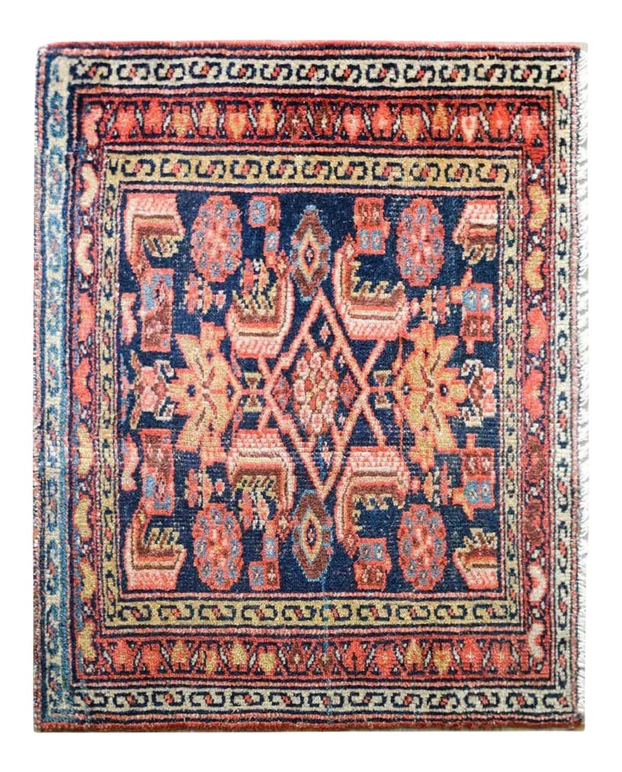 Early 20th Century Malayer Bag Face: A wonderful early 20th century Persian Malayer bag face with a wonderful tribal pattern containing stylized flowers and leaves woven in pinks, crimsons, golds, and creams, against a dark indigo