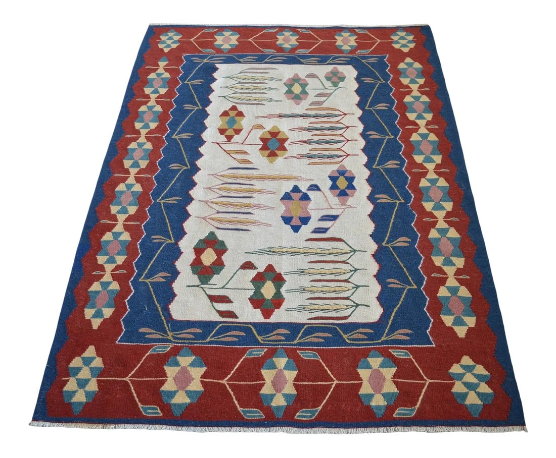 1980s Hand Woven Oushak Kilim Flat Weave Wool Area Rug: This rug with a wheat ear pattern, which is the symbol of abundance and fertility, was made in Oushak in the 1980s. Dimensions: 45" x 64" / 3 ft 9 in x 5 ft 4 in Material : Wool on wool Condition: