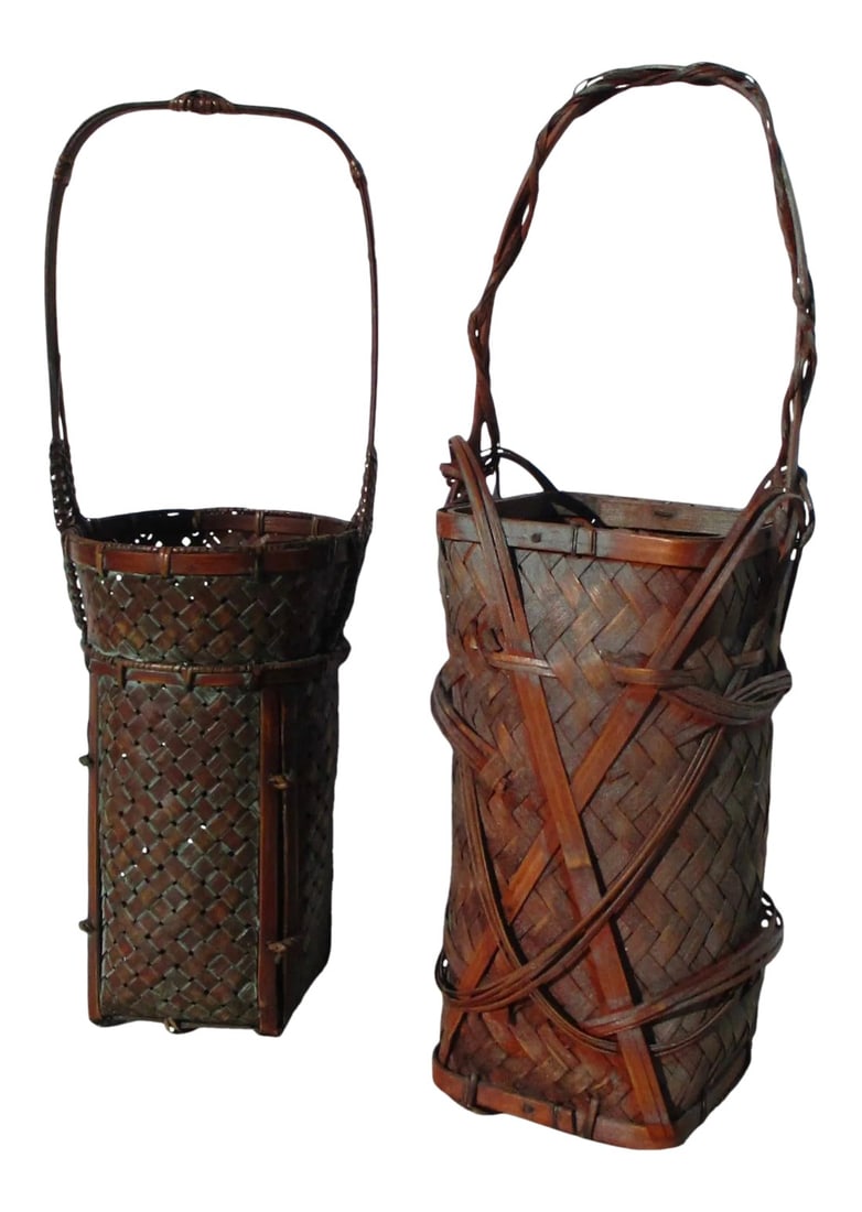 1980s Japanese Floral Ikebana Baskets- Set of 2: Two baskets for Ikebana florals. Late 20th artisan weavings in bamboo with elaborate looping and belting of bamboo braids. Round form and square form with high handles banded in crisscross designs.