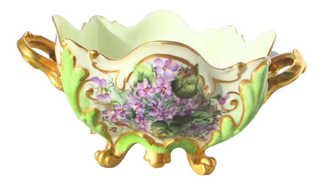 Antique Elite Limoges France Hand-Painted CenterBowl: Elite Limoges hand-painted scalloped centerpiece. Initialed T.L. by artist and dated 1896, the Bombay and bowed scalloped rim rising on four scrolling feet. Gold luster and fresh green ground the
