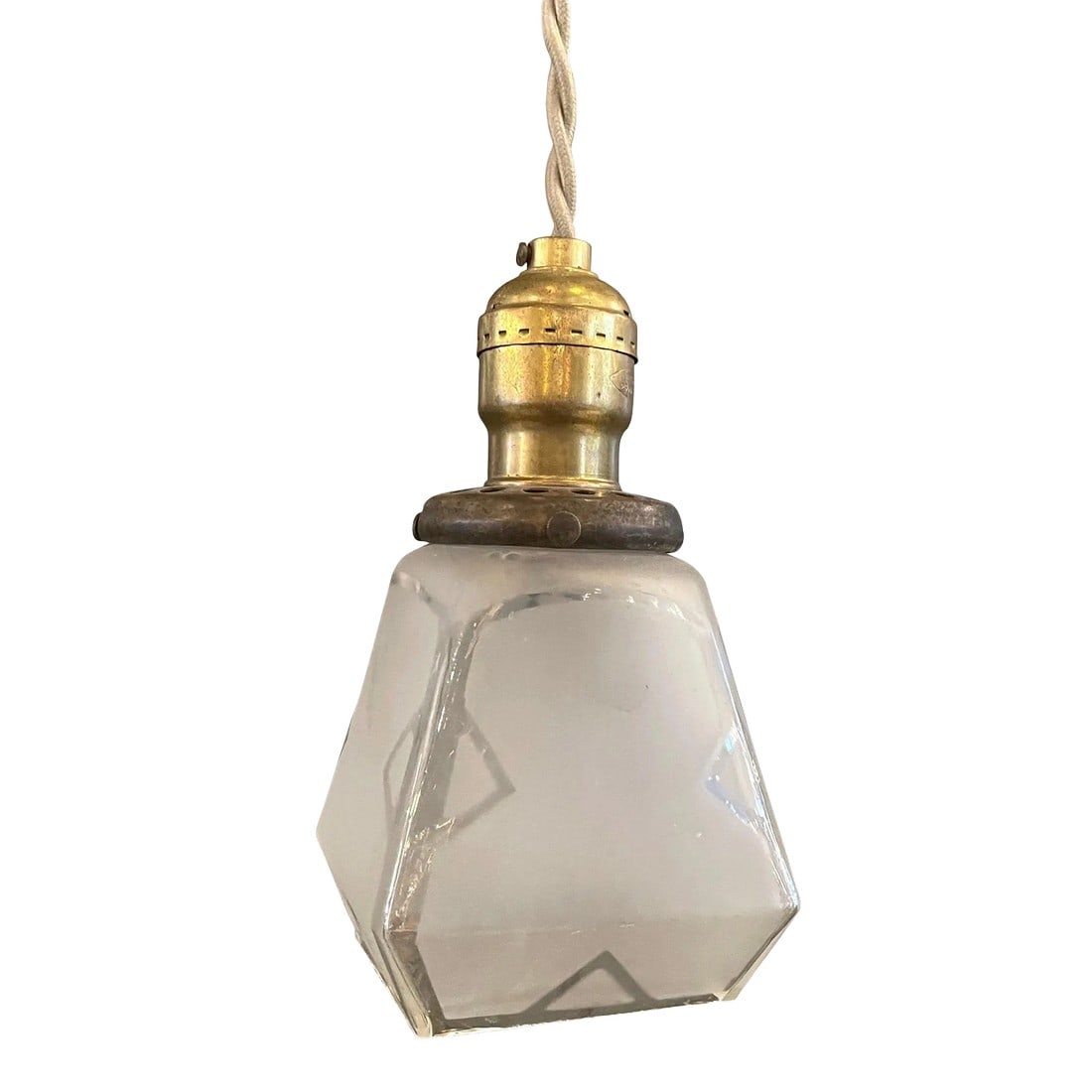 Mid 20th Century Arts & Crafts Faceted Frosted Glass Pendant Light: Petite, arts and crafts, pendant light with faceted, clear and frosted glass shade and brass pull chain hardware is newly wired with beige barided cloth cord to hang at 77 inches overall length. 