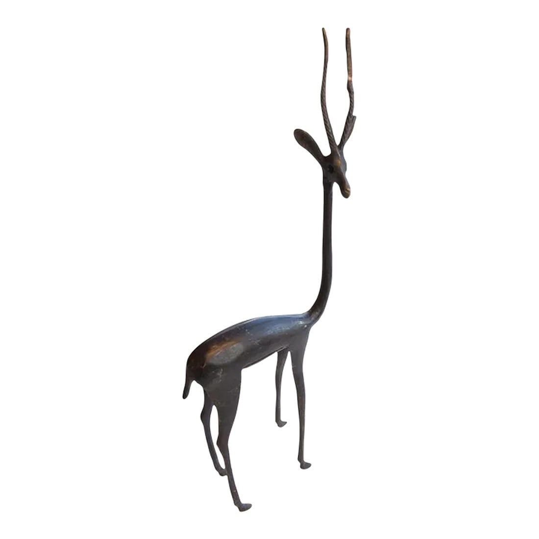 Vintage African Right Facing Gazelle With Dark Patina: :: Vintage handmade African gazelle. Made approximately 40-70 years ago, each figure in this collection represents a different variation of protection and spirit used inside and outside of the local h