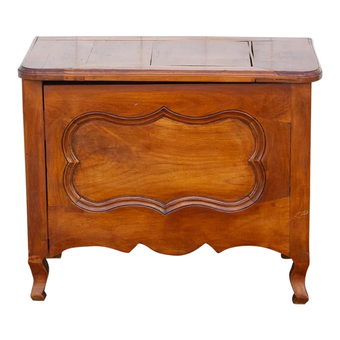 19th Century French Fruitwood Chest: An antique French Louis Philippe style small cabinet with a lift-up top. This antique French chest is made from Fruitwood and features simple softly rounded lines with a paneled front scalloped
