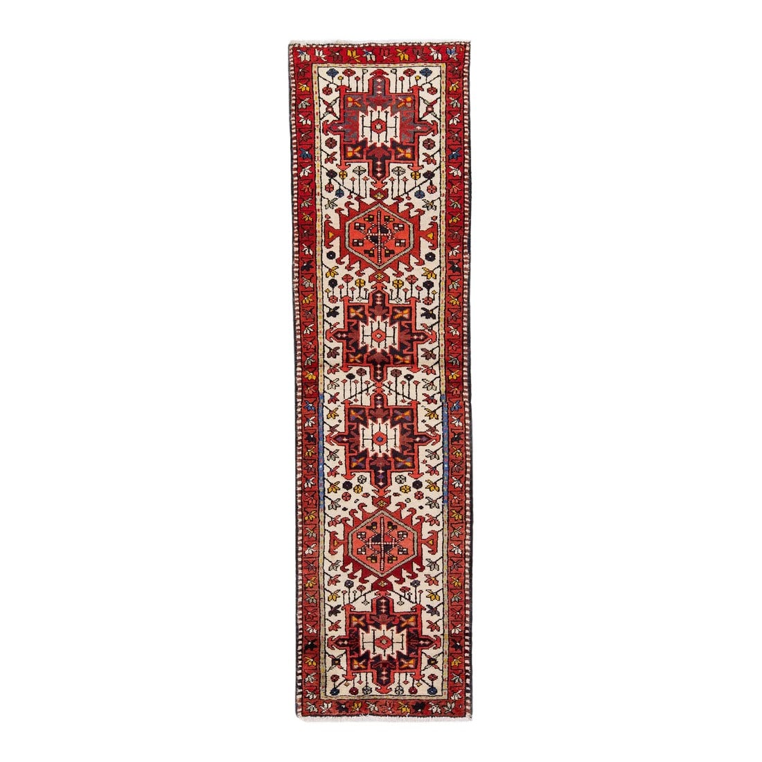 1960s Red Vintage Persian Heriz Handmade Geometric Wool Runner: Beautiful vintage Persian Heriz hand-knotted wool runner with a red color field. This rug has a red frame and multicolor accents in an all-over geometric tribal design. This rug measures: 2'1" x