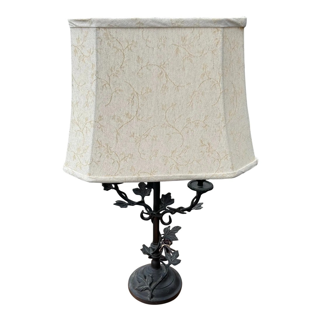 1980s Iron Ivy Lamp: Iron and Metal Lamp with Twists of Ivy Leaves Climbing upside the Lamp. Comes with Shade and a finial. Width and Depth is of Lamp Shade included. Condition: Alterations: Original Condition