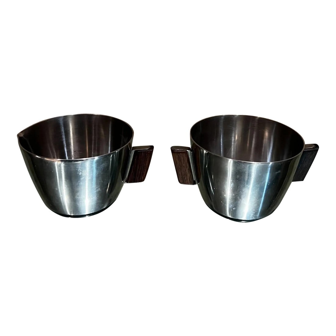 1970s by Mch Stainless Sugar & Creamer Set Exotic Wood Denmark: AMBIANIC presents 1970s by MCH Sugar & Creamer Set made Denmark. Stainless steel with exotic wood handles. Sugar 2.38 tall x 4.88 w x 3.38 diameter Creamer 2.38 tall x 4.25 w x 3.38 diameter Denmark