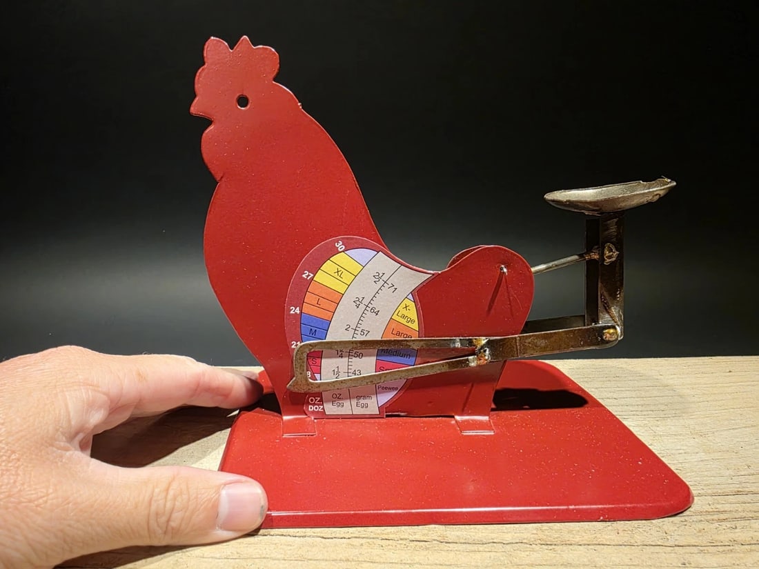 6 1/5" Red Metal Country Egg Scale: Title: 6 1/5" Antique Vintage Style Red Metal Country Egg Scale Description: 7" long x 6 1/2" Tall Vintage Style Red Metal Egg Scale – Farmhouse Poultry Grading Tool This charming vintage-style