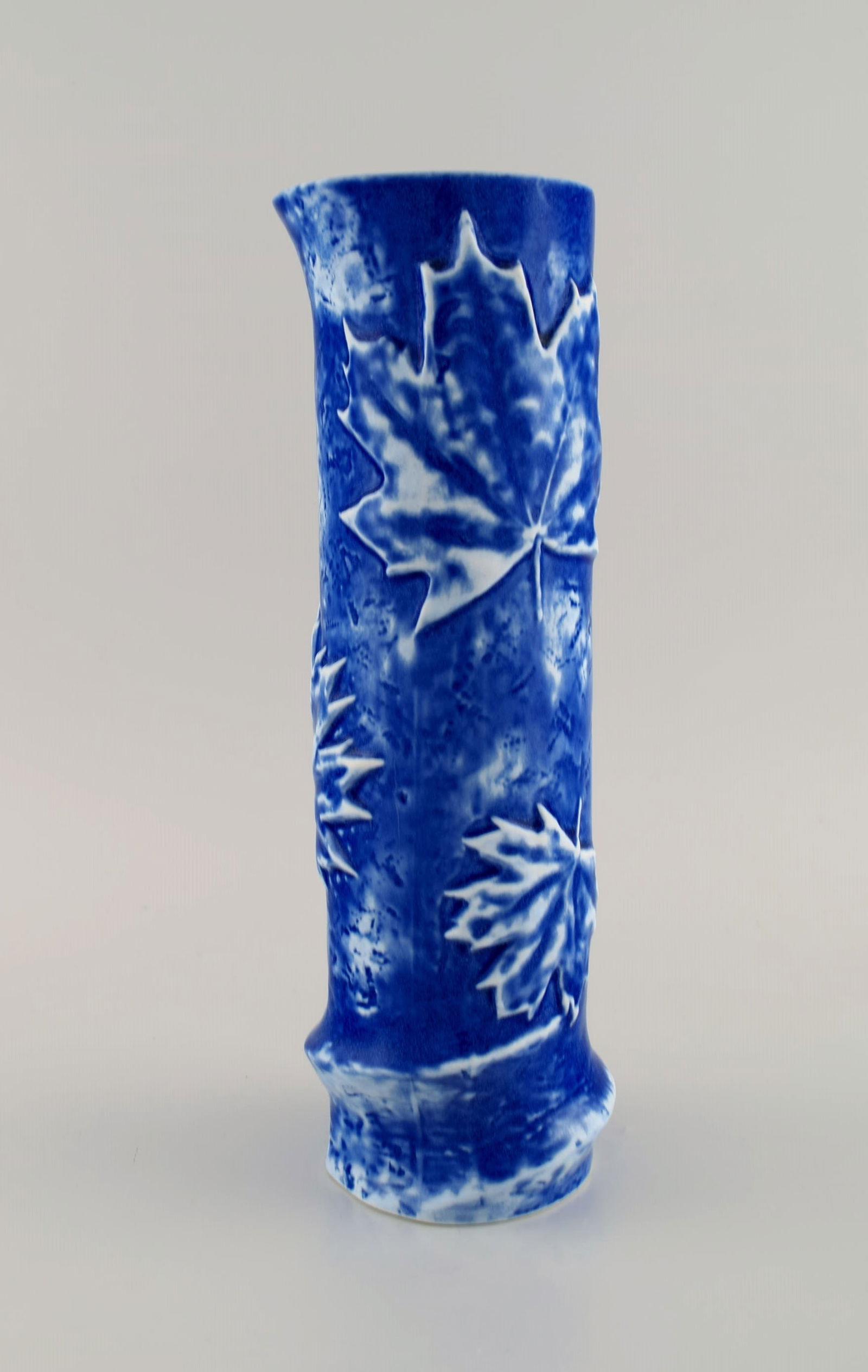 European studio ceramicist. Cylindrical vase in glazed ceramic decorated with maple leaves. (1 of 6)