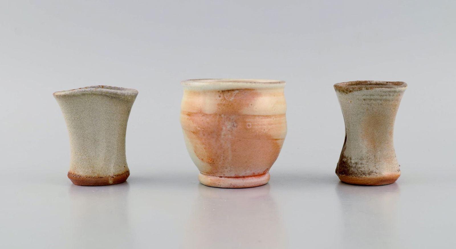 Danish studio ceramicist. Three unique vases in glazed stoneware. Beautiful glazes in peach and (1 of 6)