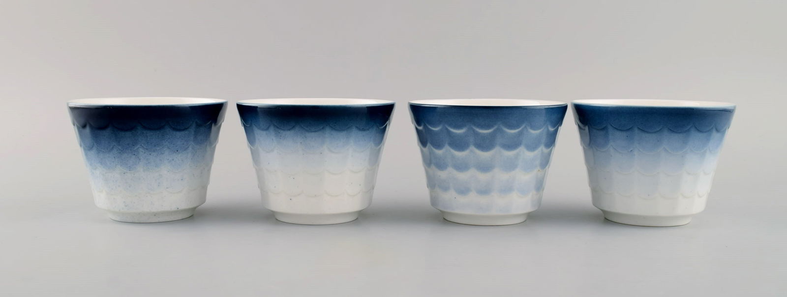 Wilhelm Kåge for Gustavsberg. Four flower pot covers in porcelain. Swedish design, 1960s. (1 of 7)