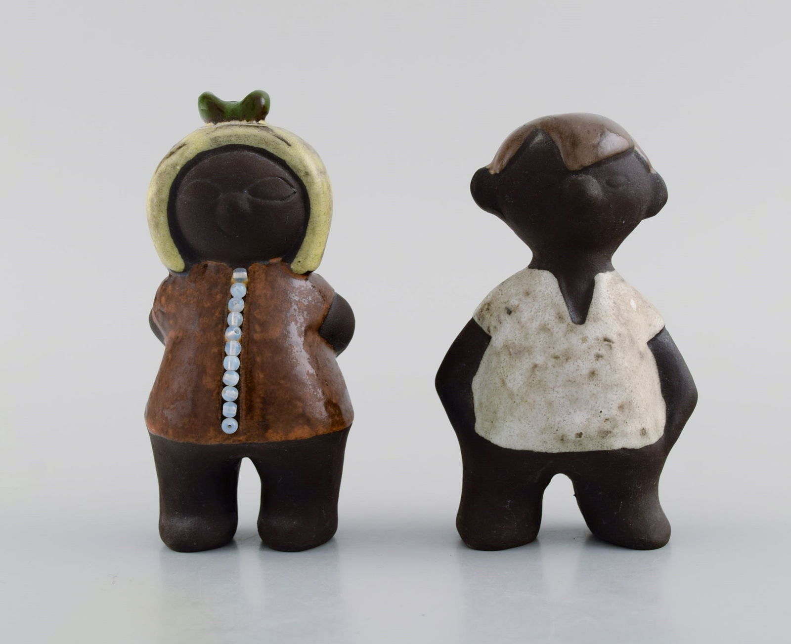 Karl Erik Iwar (1920-2006) for Nittsjö. Two figures in hand-painted glazed stoneware. Boy and (1 of 8)