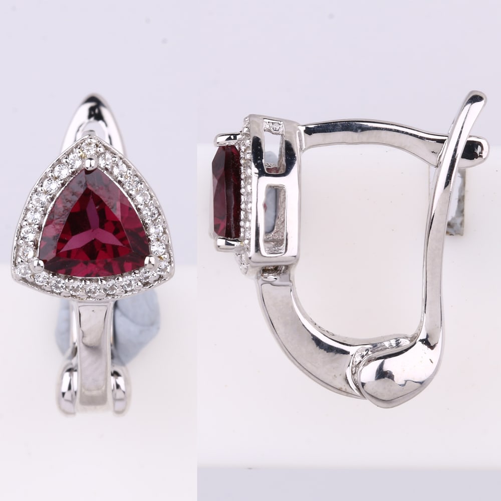 Earrings: Rhodolite Trillion 6.00mm: No Reserve! Title: Earrings: Rhodolite Trillion 6.00mm Description: Rhodolite Trillion 6.00mm - 2Pcs + White Topaz Round 0.80mm - 48Pcs Date/Period: After 2000 Materials: 925 Silver W/Rhodium Gross We